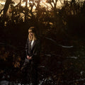 the album cover for The Weather Station - How Is It That I Should Look At The Stars [Indie Exclusive Limited Edition Gold LP]