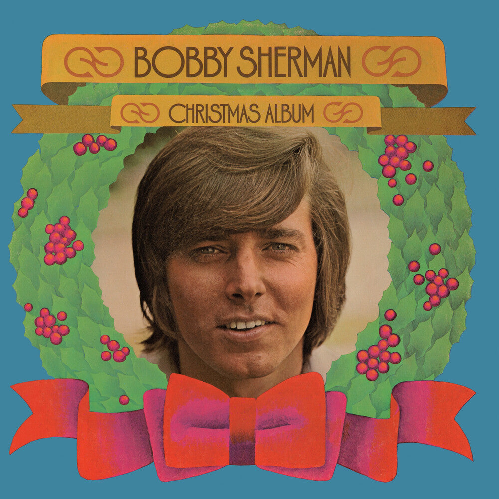 the album cover for Bobby Sherman - Bobby Sherman Christmas Album [Clear Vinyl] [Limited Edition] (Red)